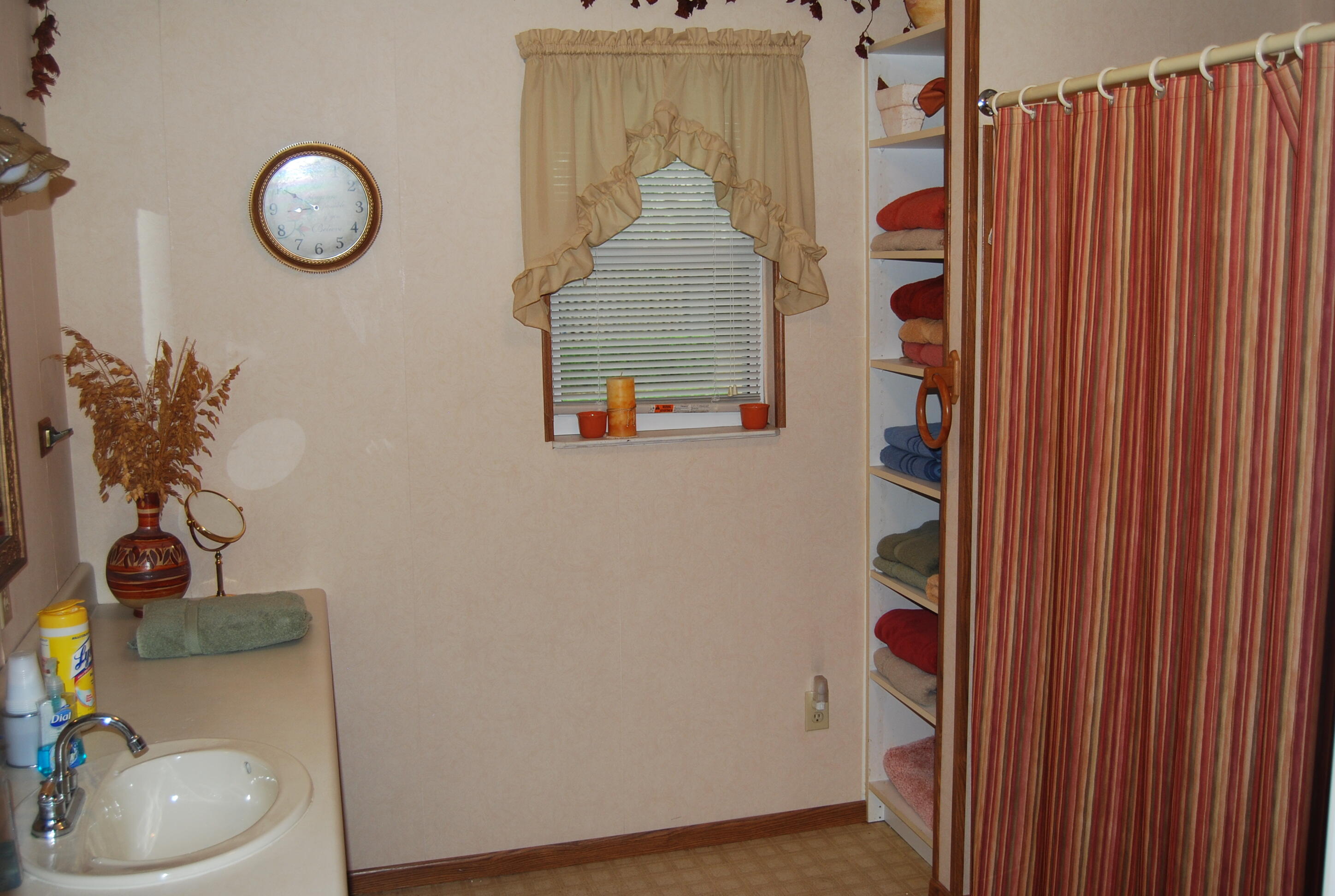 791 Dr Nelson Road DeFuniak Springs, FL 32433 - Photo 16 of 46 a bathroom with a toilet and a sink