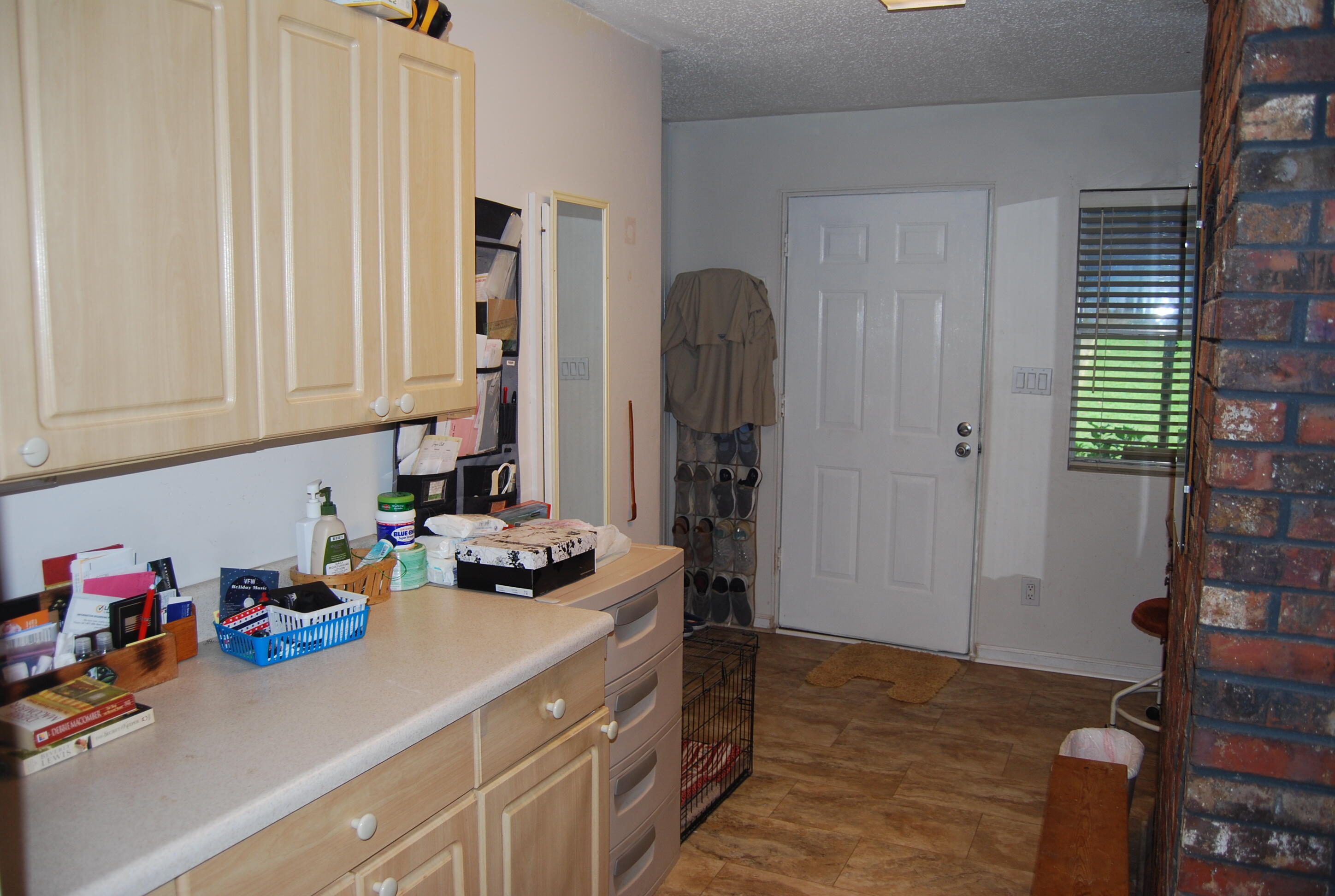 791 Dr Nelson Road DeFuniak Springs, FL 32433 - Photo 21 of 46 a kitchen with stainless steel appliances a sink cabinets and a window