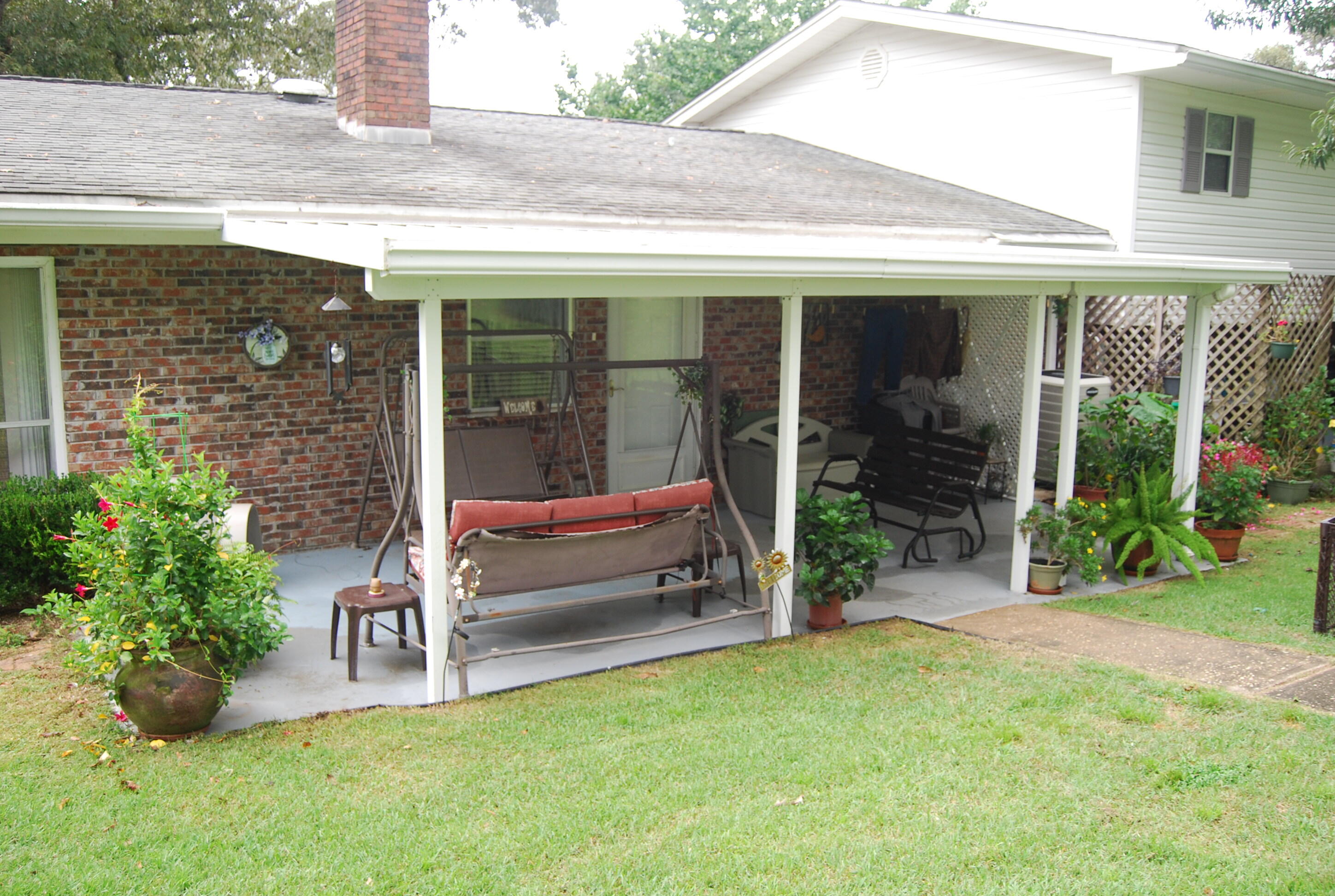 791 Dr Nelson Road DeFuniak Springs, FL 32433 - Photo 28 of 46 a view of a chair and table in backyard of the house