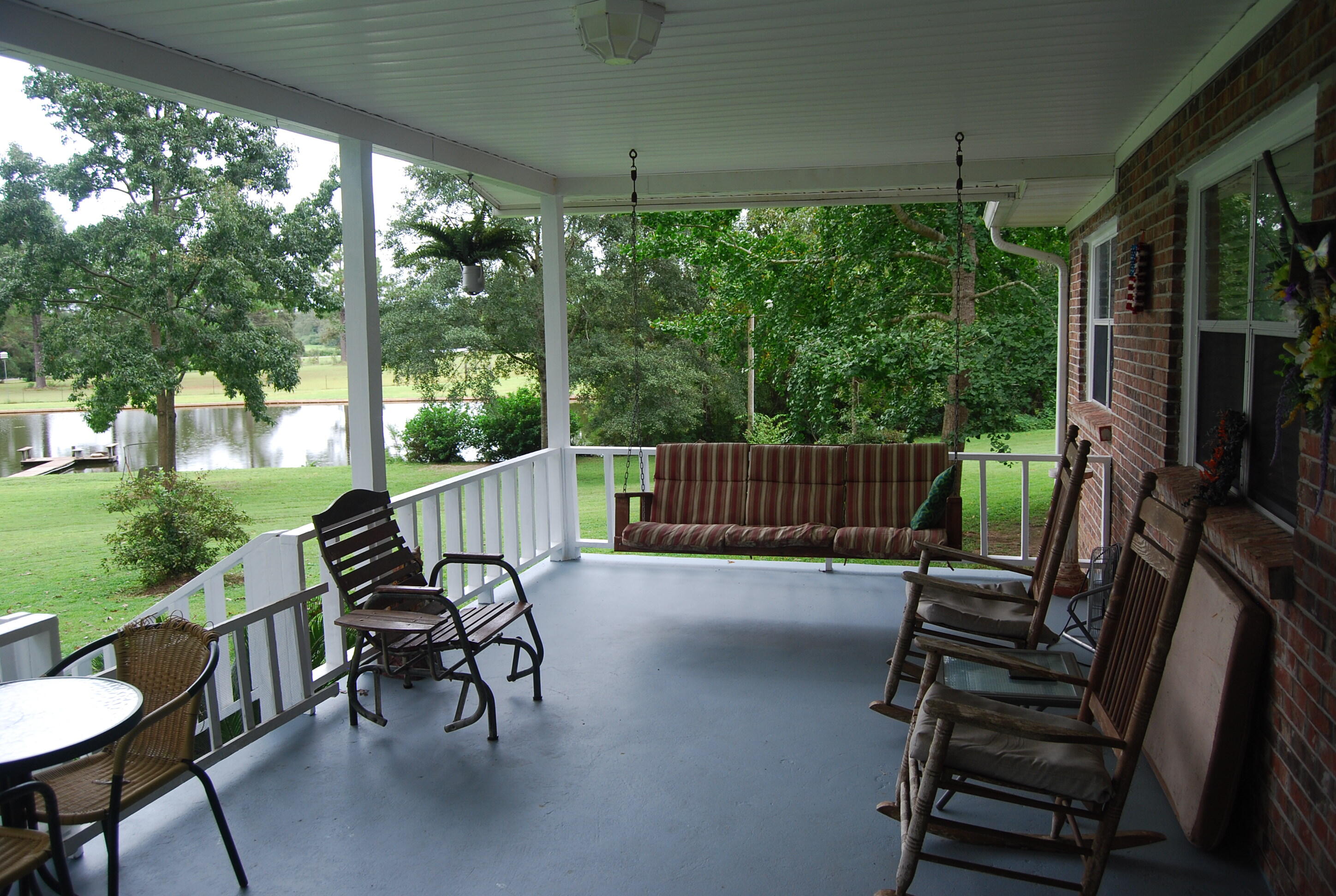 791 Dr Nelson Road DeFuniak Springs, FL 32433 - Photo 7 of 46 a view of a chair and tables in the patio