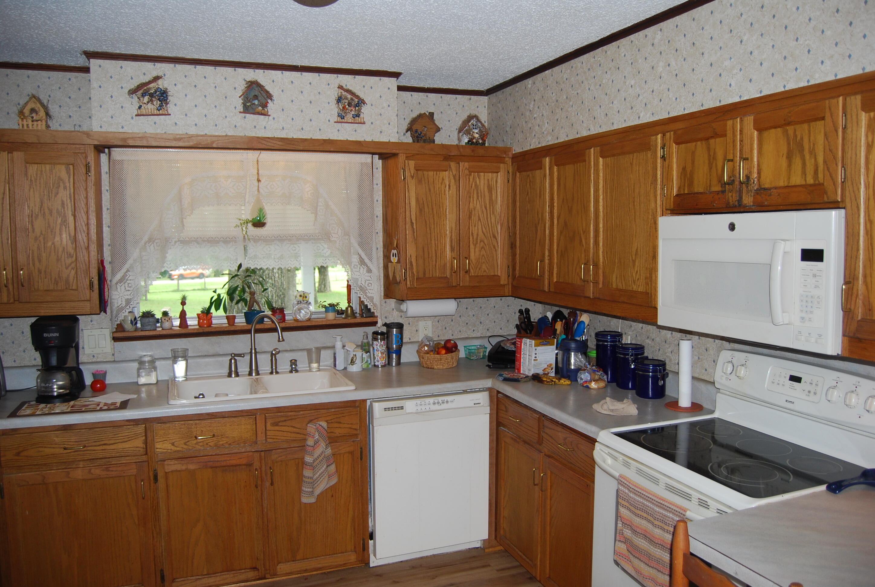 791 Dr Nelson Road DeFuniak Springs, FL 32433 - Photo 9 of 46 a kitchen with stainless steel appliances wooden cabinets sink and cabinets