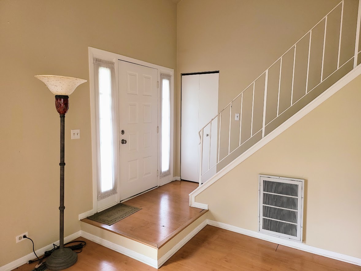 216 Ivy Court Streamwood, IL 60107 - Photo 2 of 14 a view of a hallway with staircase