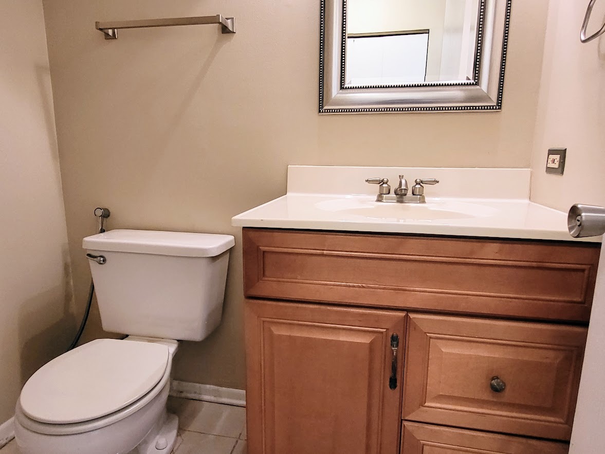 216 Ivy Court Streamwood, IL 60107 - Photo 9 of 14 a bathroom with a toilet and a sink