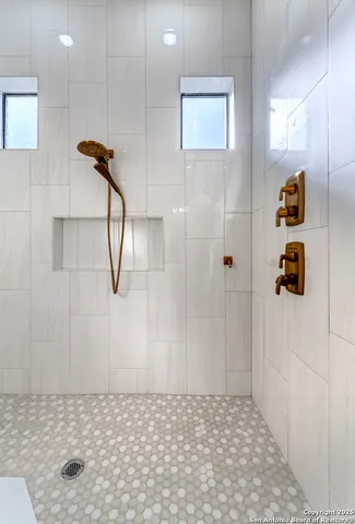a white bath tub sitting in a bathroom