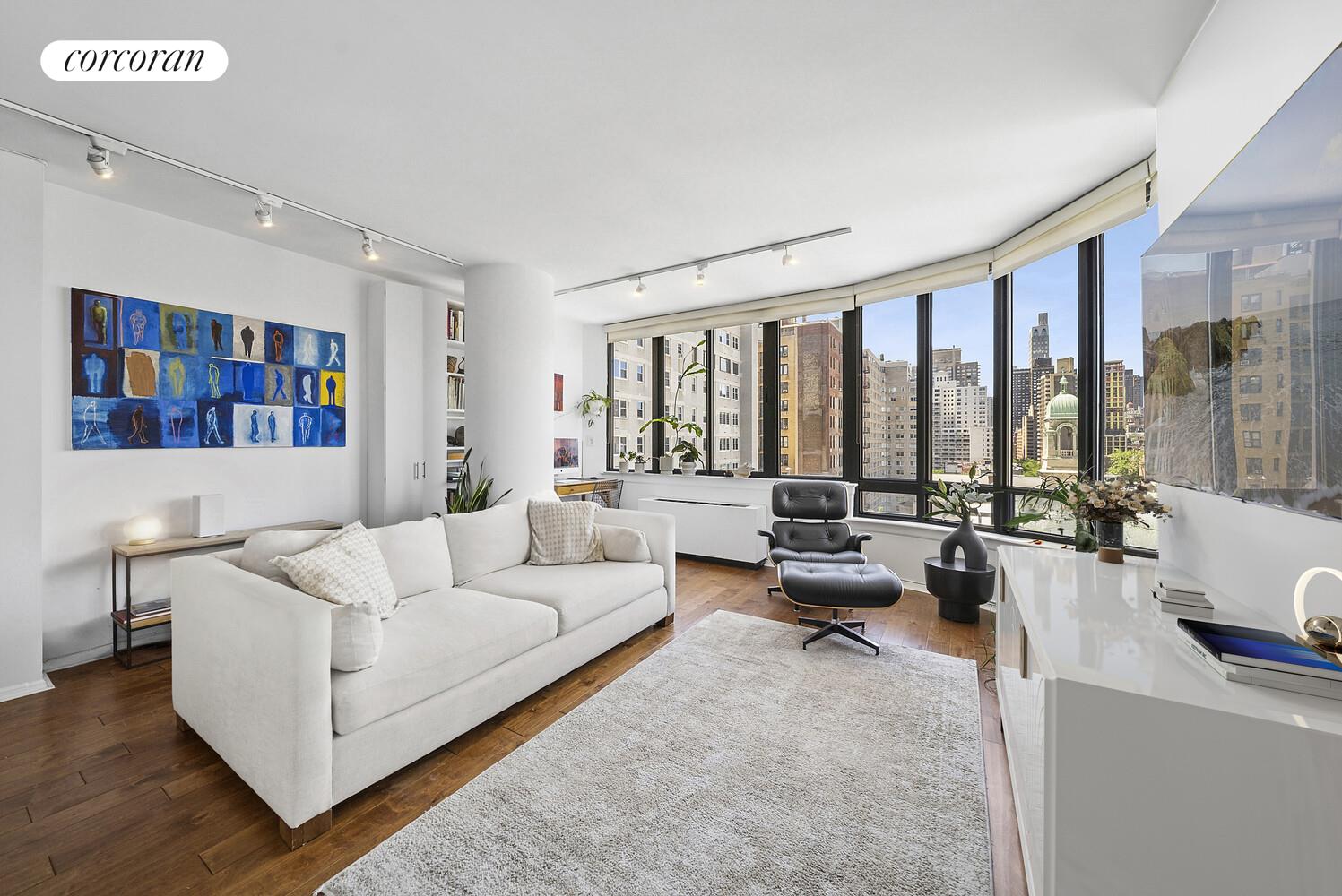 a living room with furniture and large window