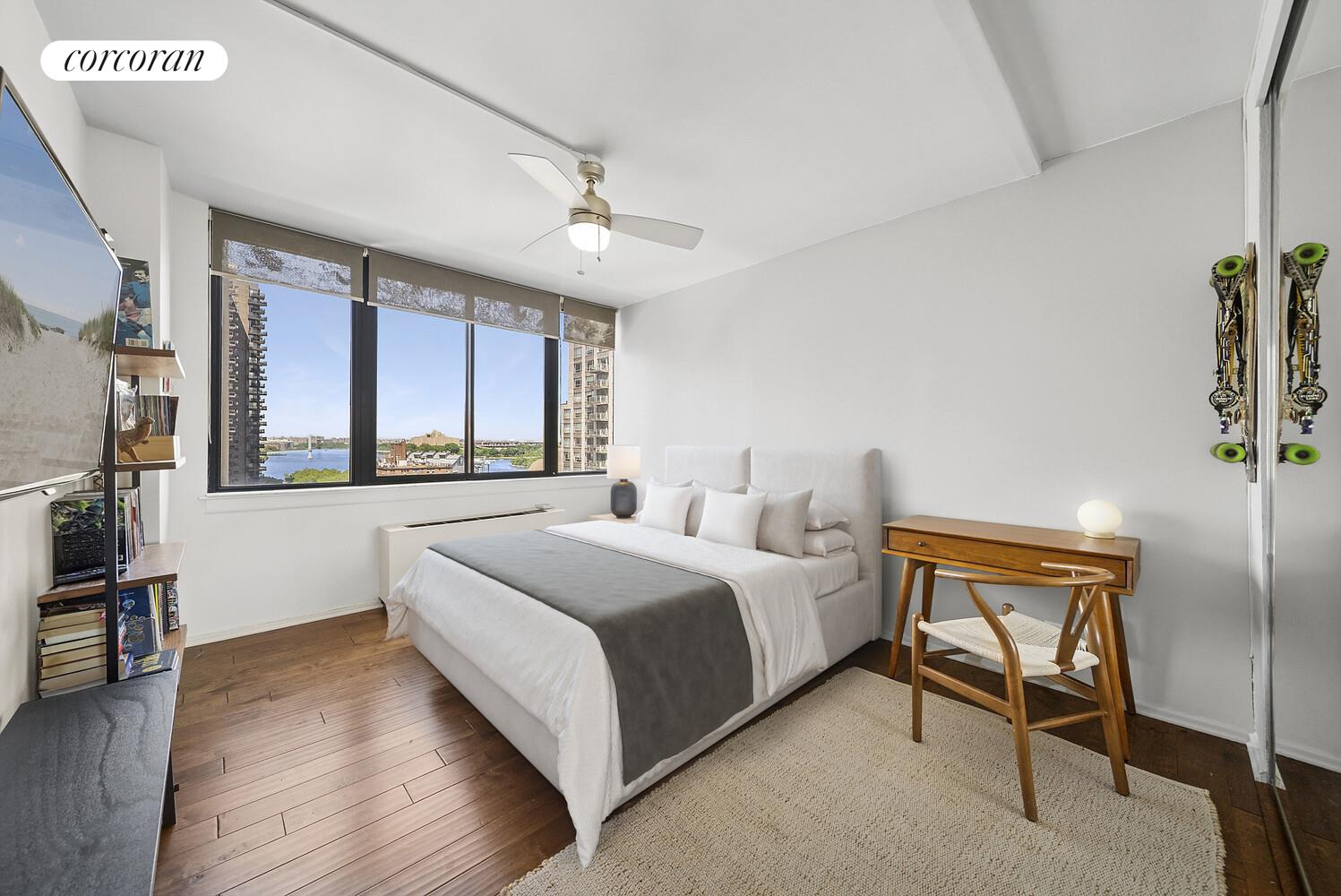 455 East 86th Street, Unit 11AB Manhattan, NY 10028 - Photo 13 of 15 a bedroom with a bed and a large window