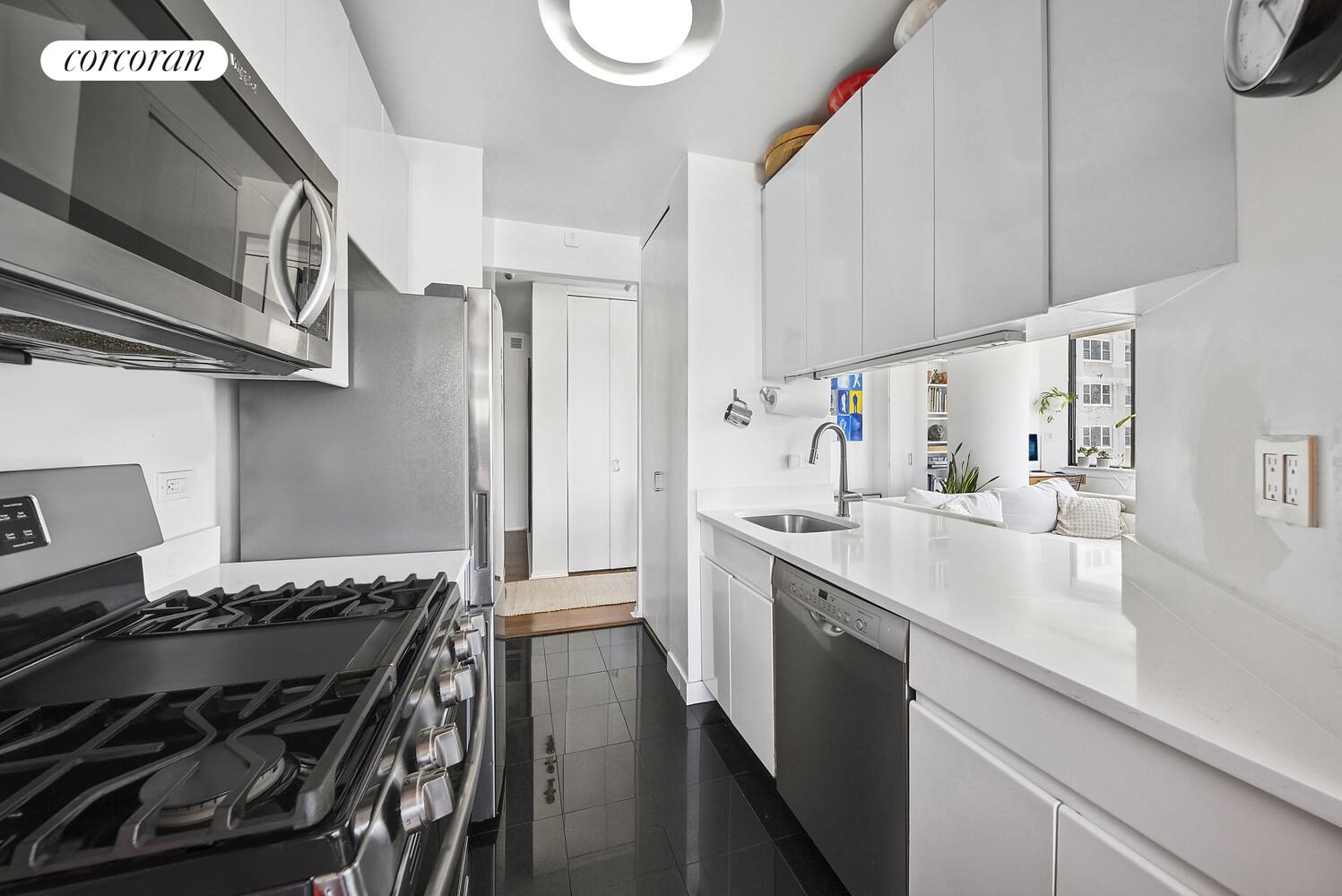 455 East 86th Street, Unit 11AB Manhattan, NY 10028 - Photo 5 of 15 a kitchen with a stove and a sink