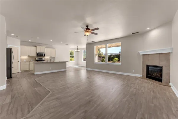 a kitchen with granite countertop a stove a sink and a granite counter tops