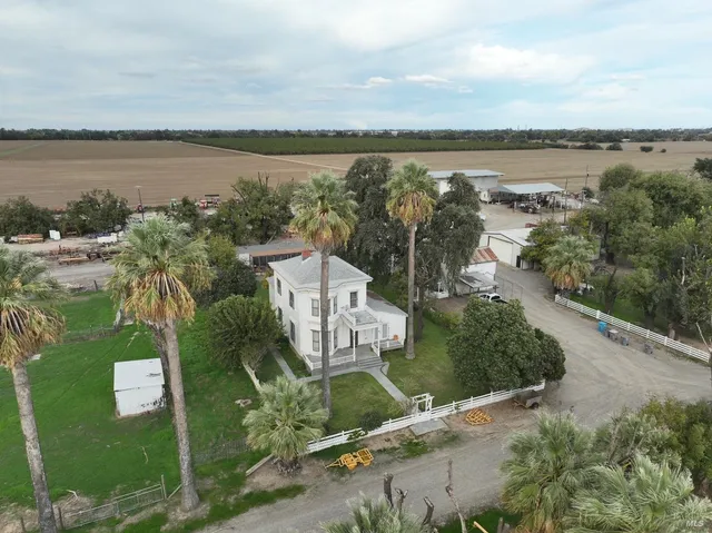 an aerial view of a house with a lake view