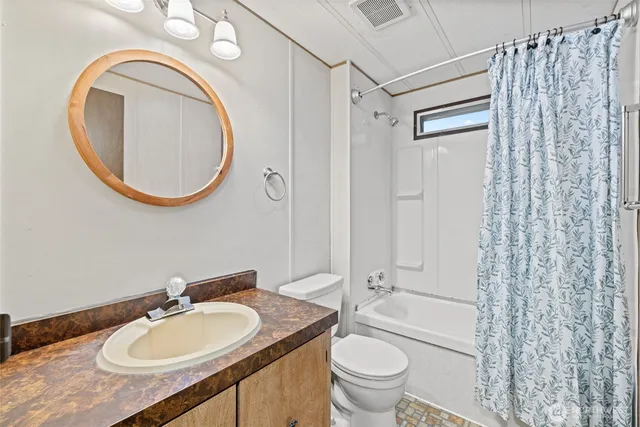 a kitchen with stainless steel appliances granite countertop a sink refrigerator and cabinets