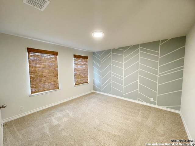 5015 Dancing Gopher San Antonio, TX 78261 - Photo 19 of 43 a view of an empty room with a window