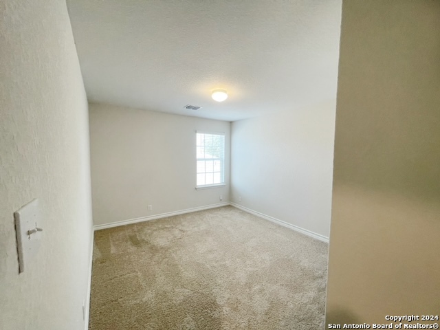 5015 Dancing Gopher San Antonio, TX 78261 - Photo 20 of 43 a view of an empty room and a window
