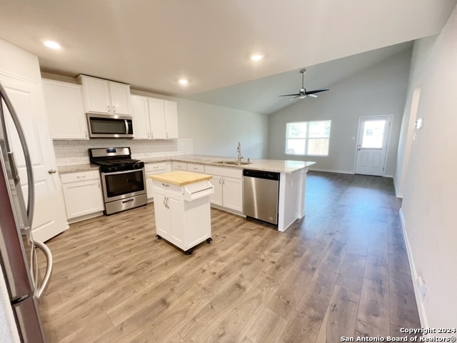 5015 Dancing Gopher San Antonio, TX 78261 - Photo 2 of 43 a kitchen with granite countertop a stove top oven sink and cabinets