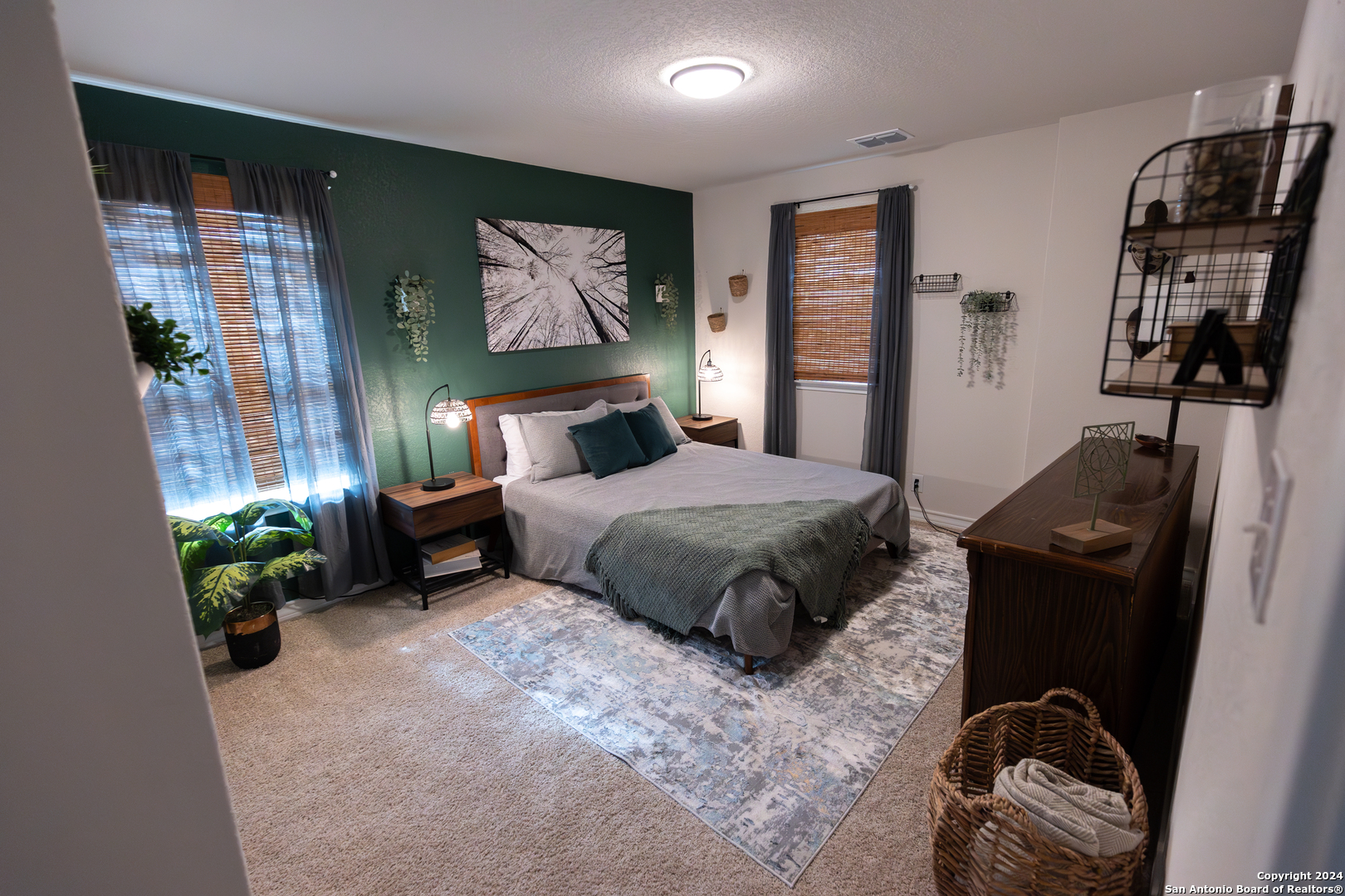 5015 Dancing Gopher San Antonio, TX 78261 - Photo 29 of 43 a bedroom with a bed and potted plants on the dresser