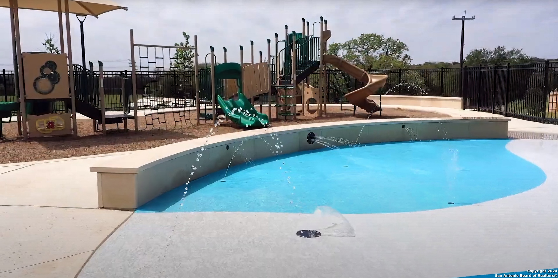 5015 Dancing Gopher San Antonio, TX 78261 - Photo 38 of 43 a view of a swimming pool with a chair and palm trees