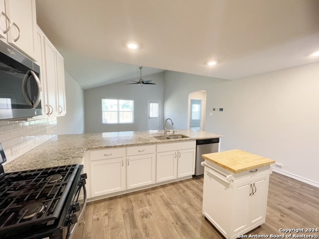 5015 Dancing Gopher San Antonio, TX 78261 - Photo 5 of 43 a kitchen with a sink stove and cabinets