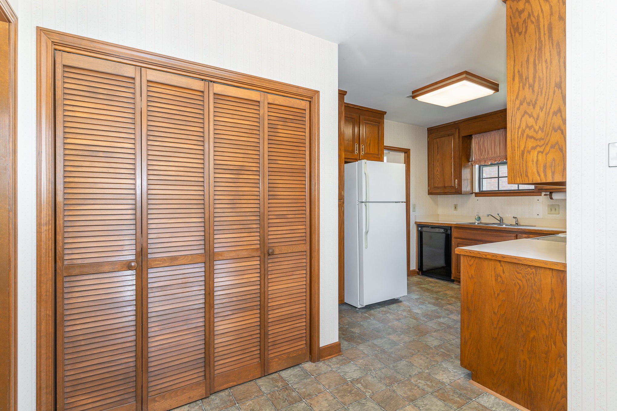 636 General George Patton Road Nashville, TN 37221 - Photo 14 of 32 a view of a kitchen with a sink and refrigerator