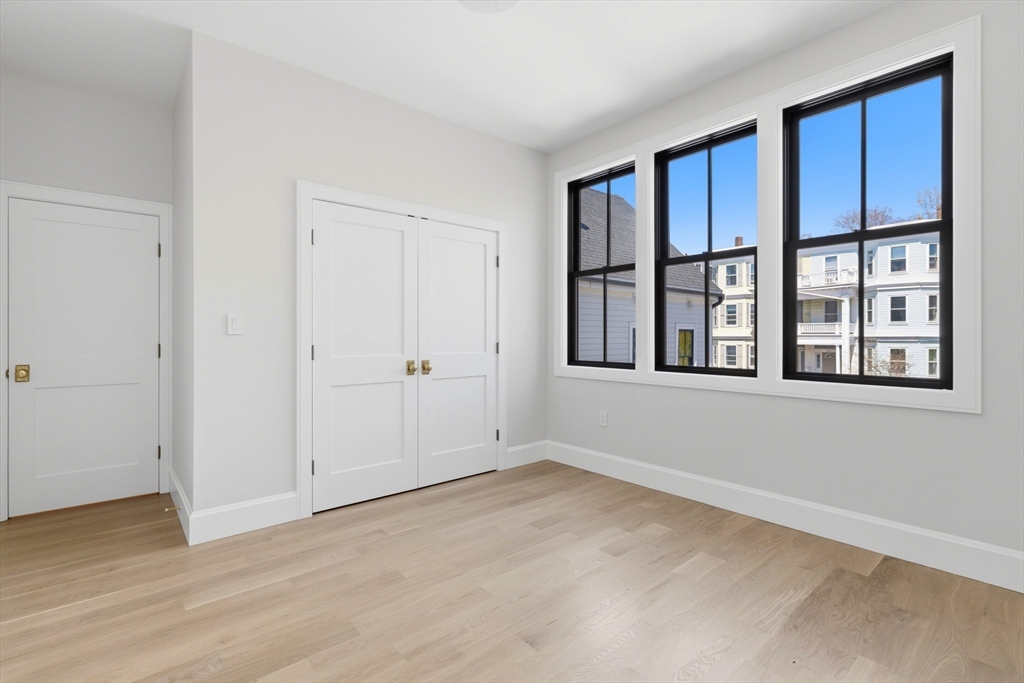 847 East 5th Street, Unit 2 Boston, MA 02127 - Photo 21 of 24 a view of an empty room with a window