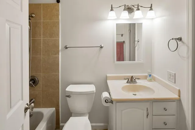 a view of a workspace with wooden floor