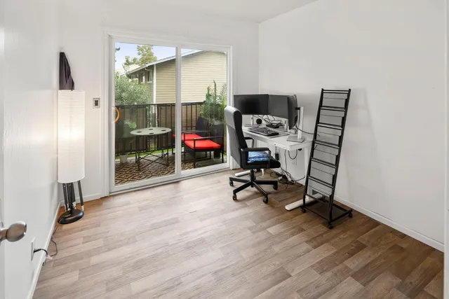 a view of a balcony with furniture