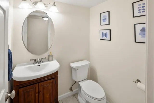 a kitchen with a stove a refrigerator a sink and wooden cabinets