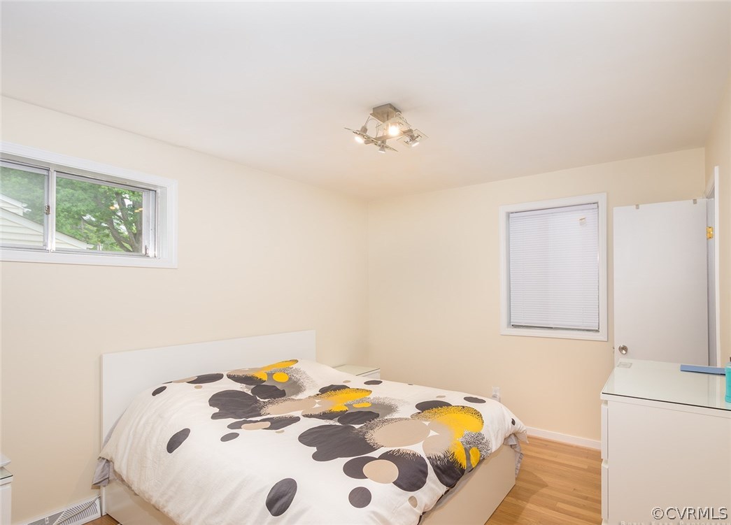 2307 Cranbrook Road Henrico, VA 23229 - Photo 12 of 18 a bedroom with a bed and a table in it