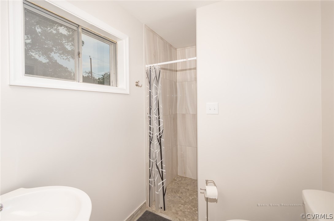 2307 Cranbrook Road Henrico, VA 23229 - Photo 15 of 18 a bathroom with a toilet and a shower