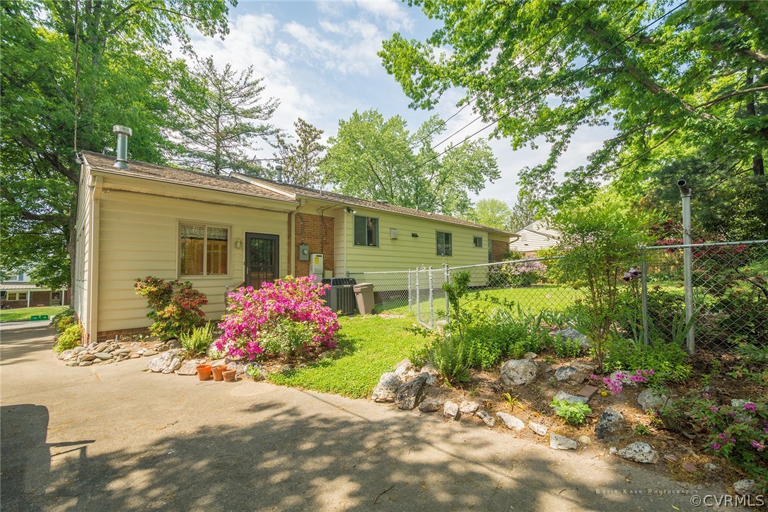2307 Cranbrook Road Henrico, VA 23229 - Photo 16 of 18 a front view of house with yard and trees around