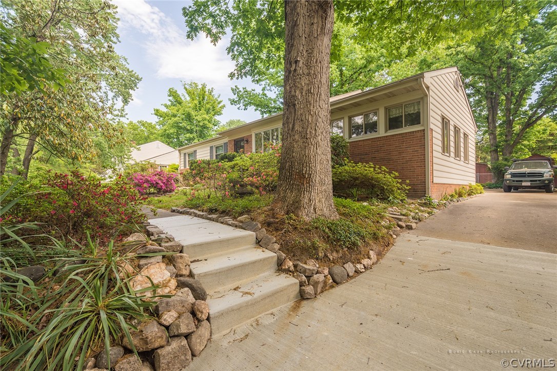 2307 Cranbrook Road Henrico, VA 23229 - Photo 2 of 18 a front view of a house with garden
