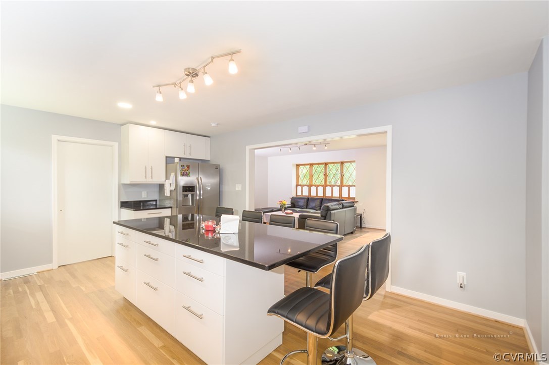 2307 Cranbrook Road Henrico, VA 23229 - Photo 5 of 18 a kitchen with a sink stove and cabinets