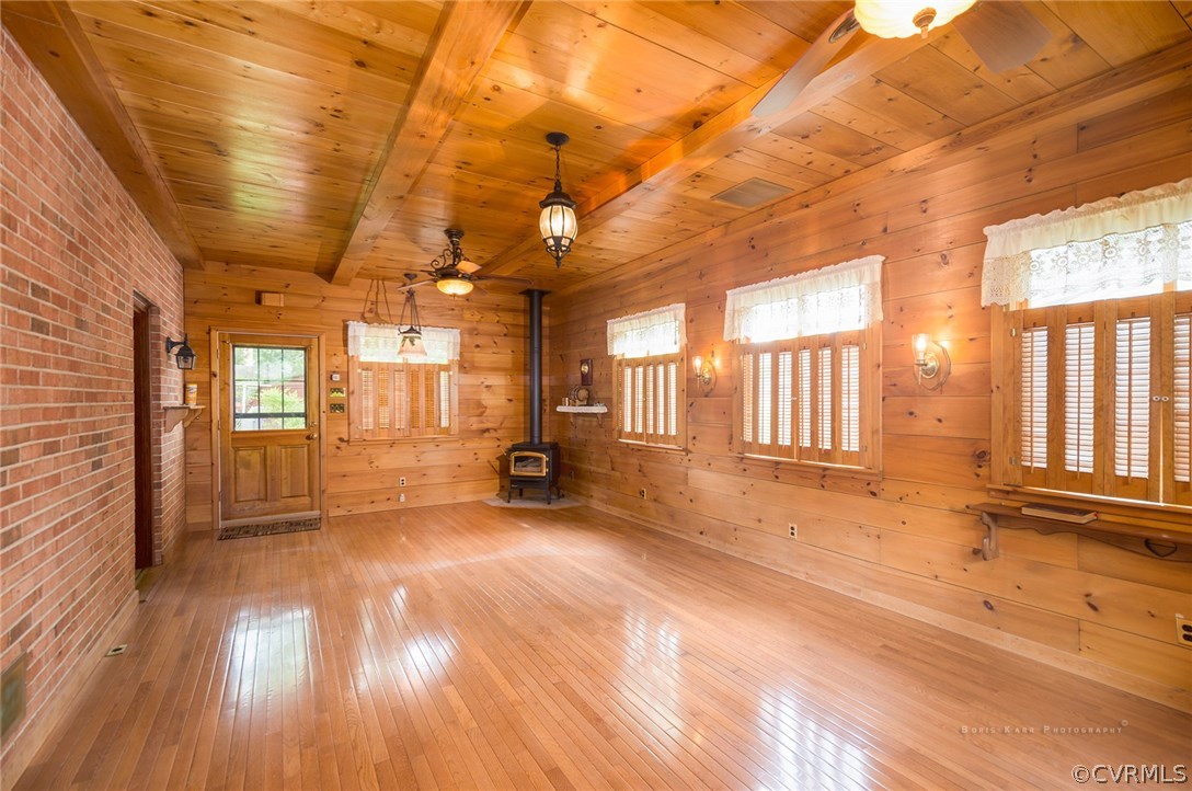 2307 Cranbrook Road Henrico, VA 23229 - Photo 9 of 18 a view of an empty room with wooden floor and a window