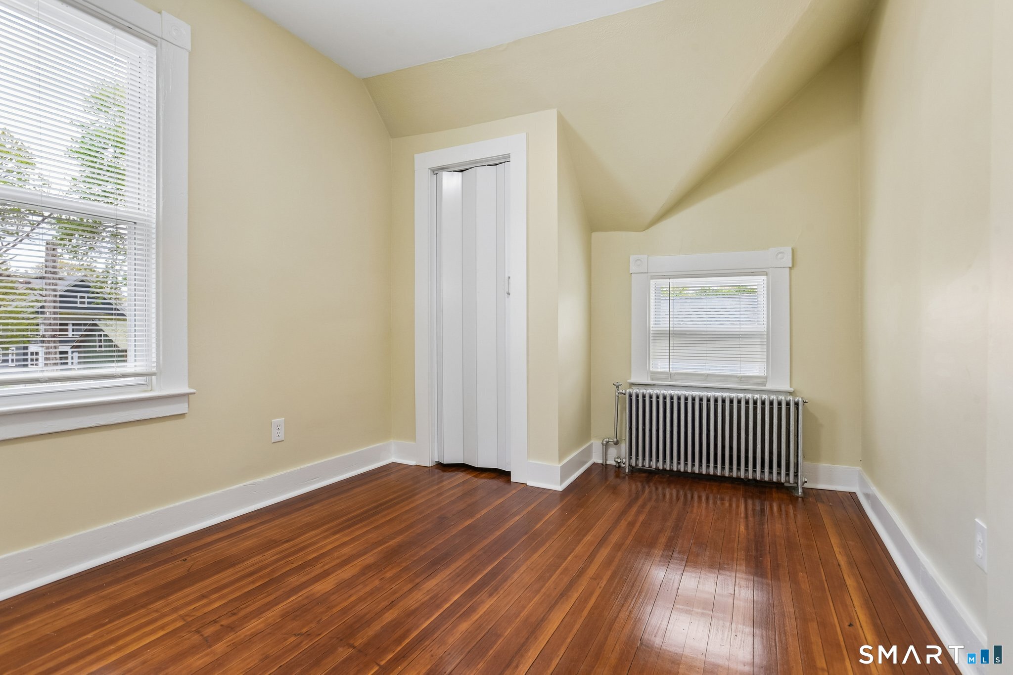 39 Grand Street, Unit 3 Middletown, CT 06457 - Photo 11 of 21 a view of empty room with wooden floor and fan