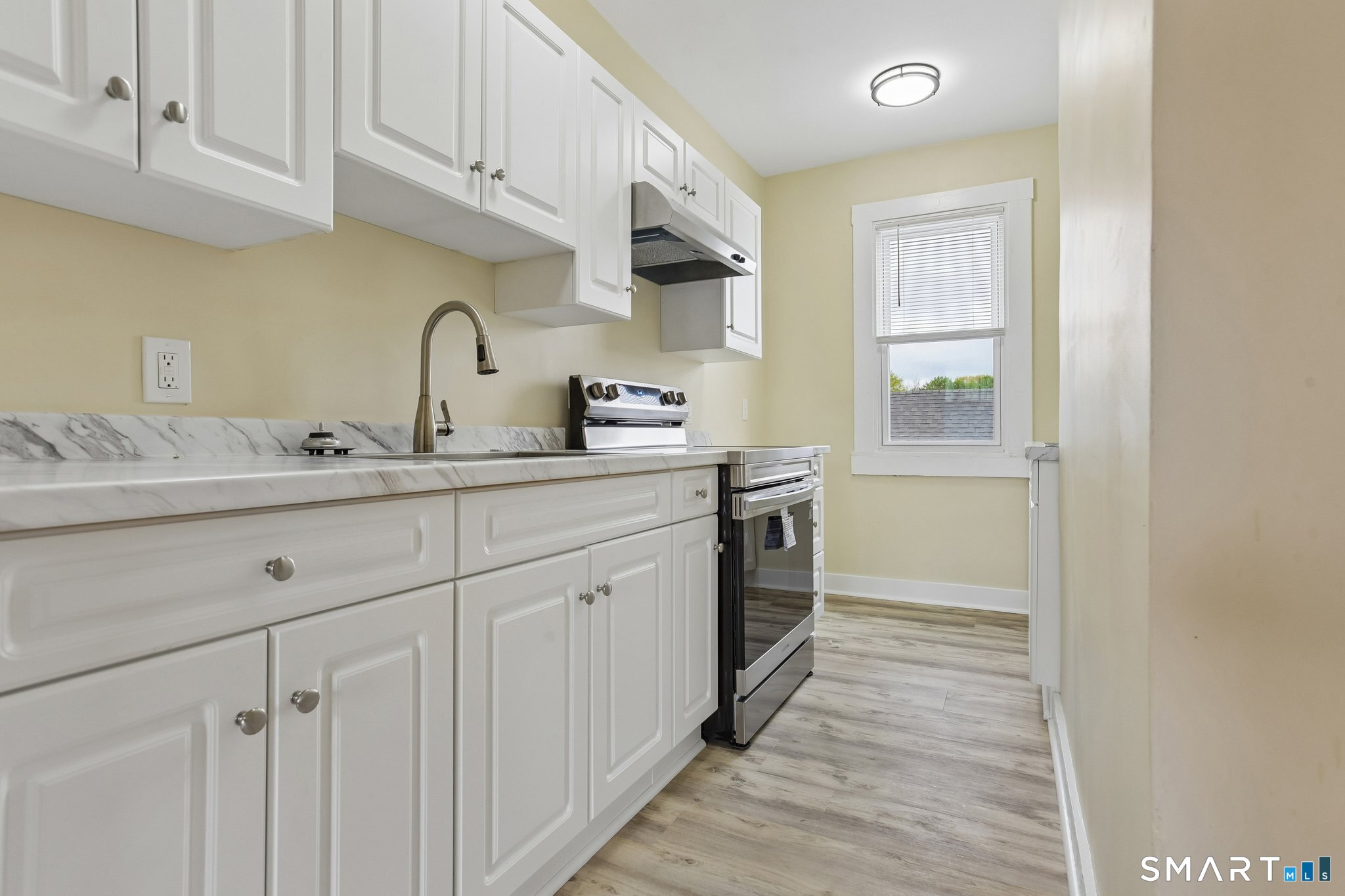 39 Grand Street, Unit 3 Middletown, CT 06457 - Photo 8 of 21 a kitchen with a sink and cabinets