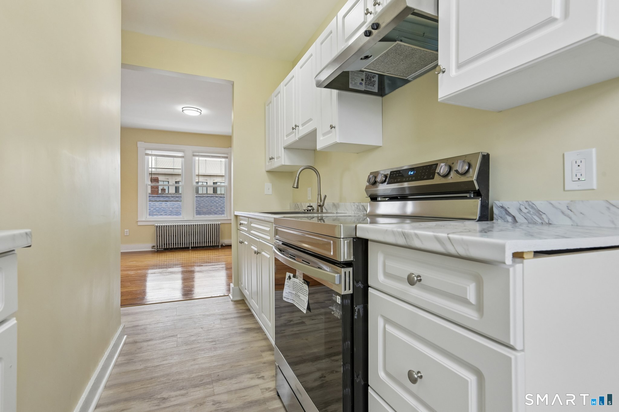 39 Grand Street, Unit 3 Middletown, CT 06457 - Photo 9 of 21 a kitchen with stainless steel appliances granite countertop a stove and a sink