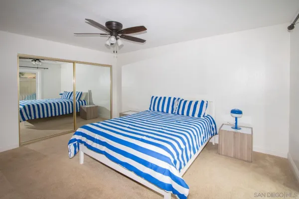 a bedroom with furniture and a chandelier
