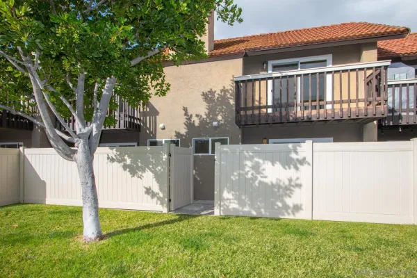 an outdoor view of house with green space
