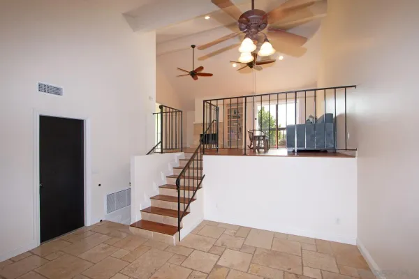 a view of entryway and hall with a front door