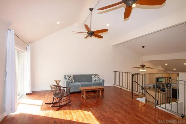 a work room with furniture and wooden floor