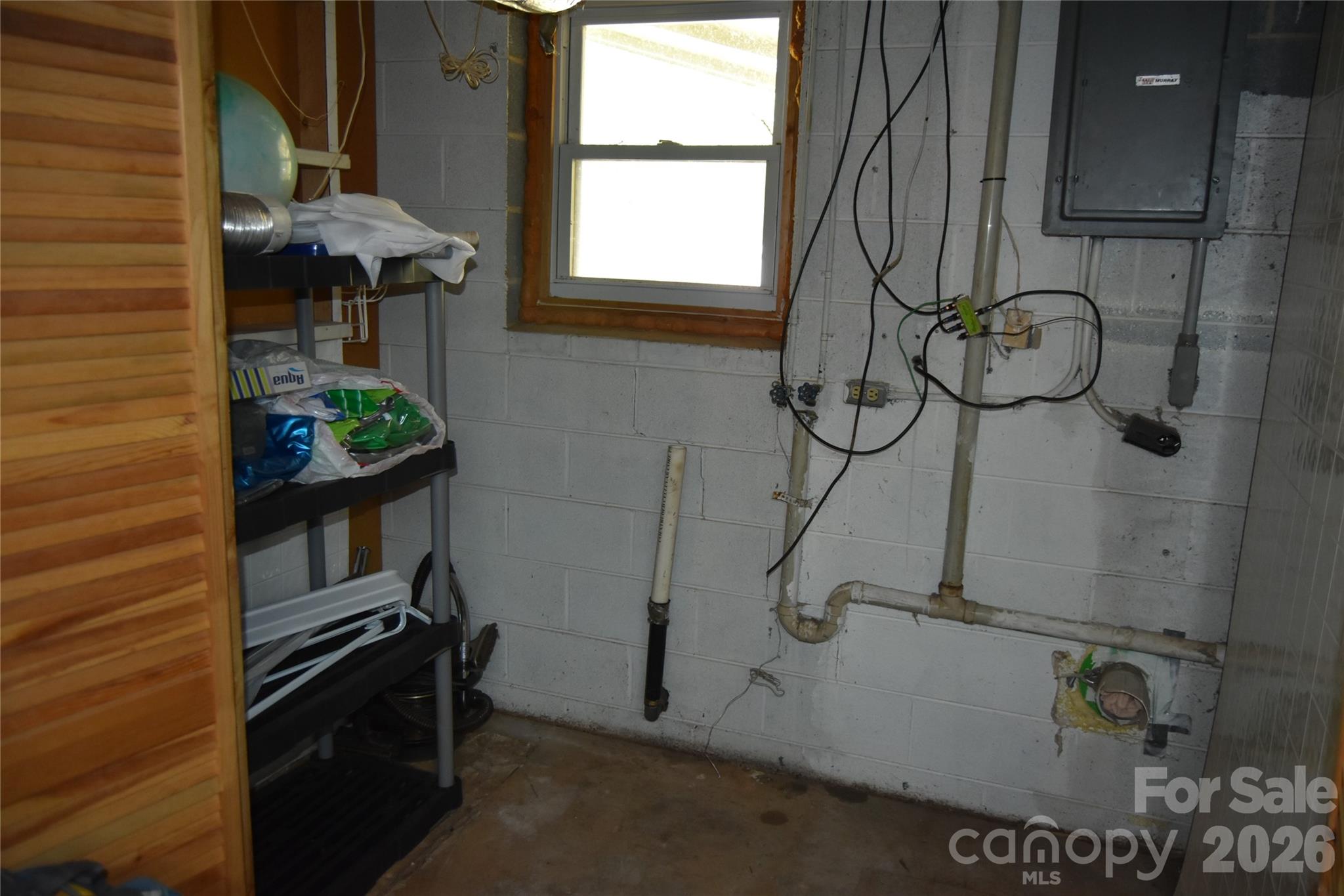 1082 Maple Street Granite Falls, NC 28630 - Photo 17 of 25 a bathroom with a sink and washing machine