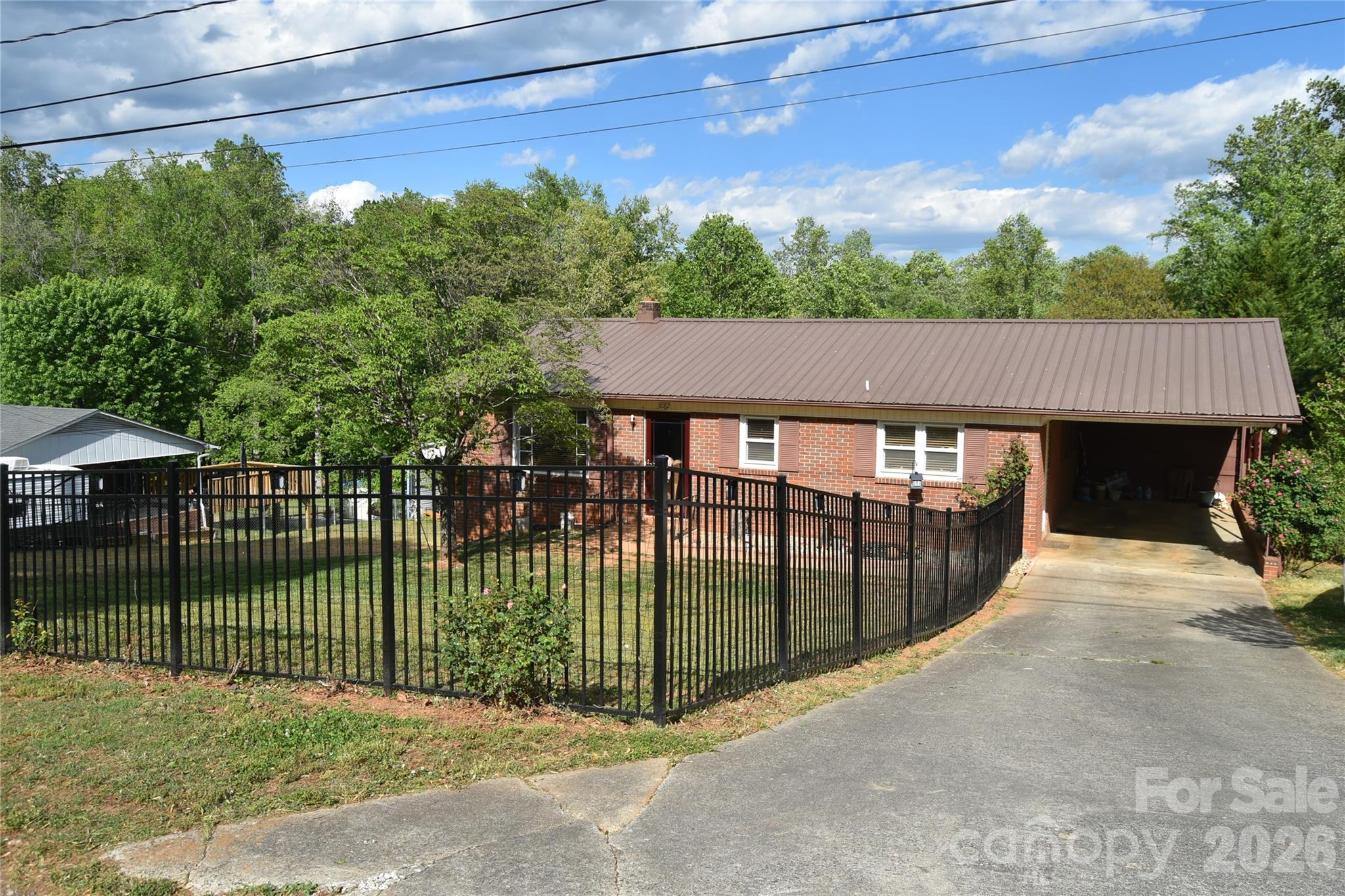 1082 Maple Street Granite Falls, NC 28630 - Photo 3 of 25 a view of a house with a balcony