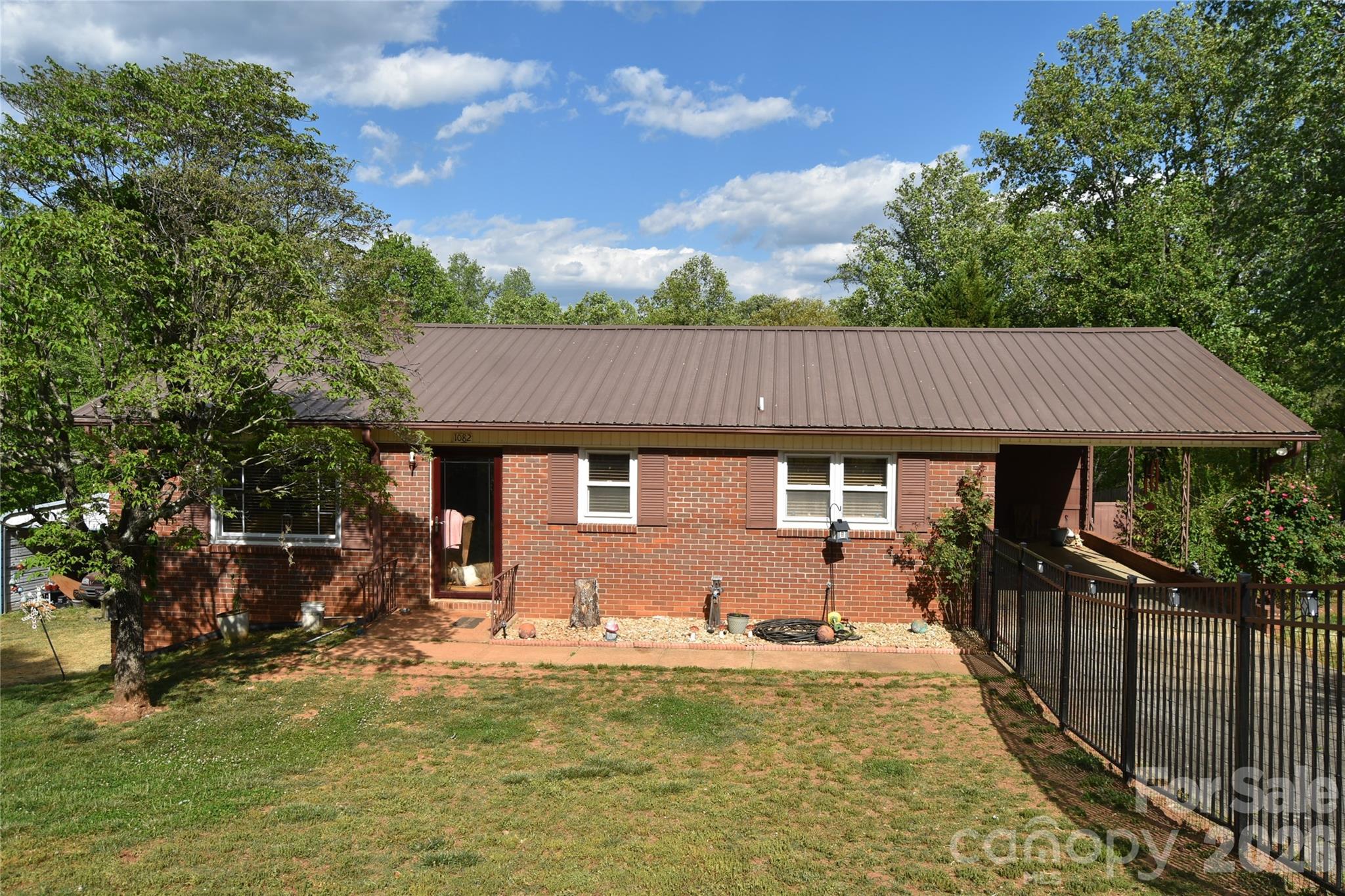 1082 Maple Street Granite Falls, NC 28630 - Photo 4 of 25 a front view of a house with yard patio and slide