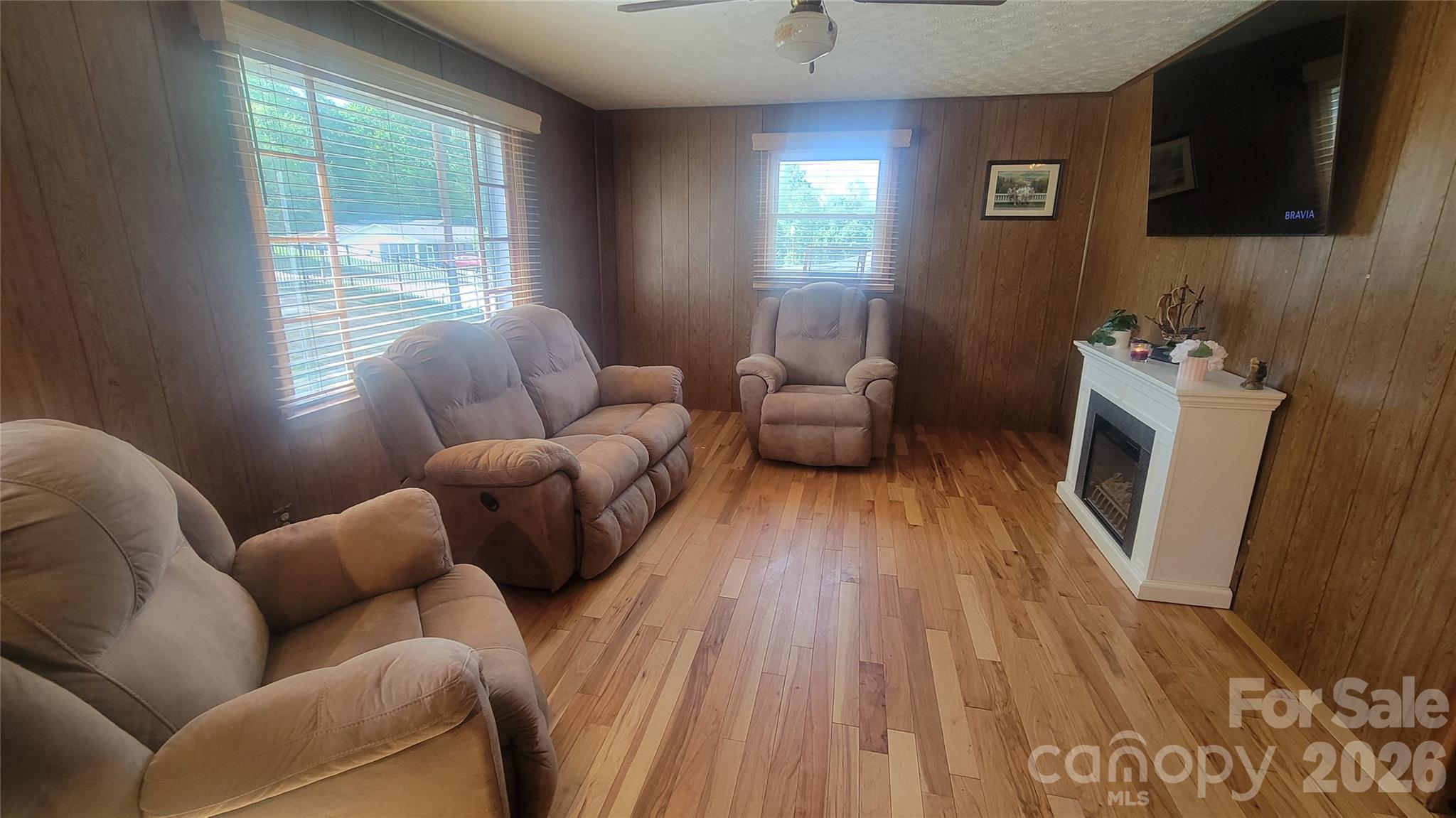 1082 Maple Street Granite Falls, NC 28630 - Photo 6 of 25 a living room with furniture and a flat screen tv