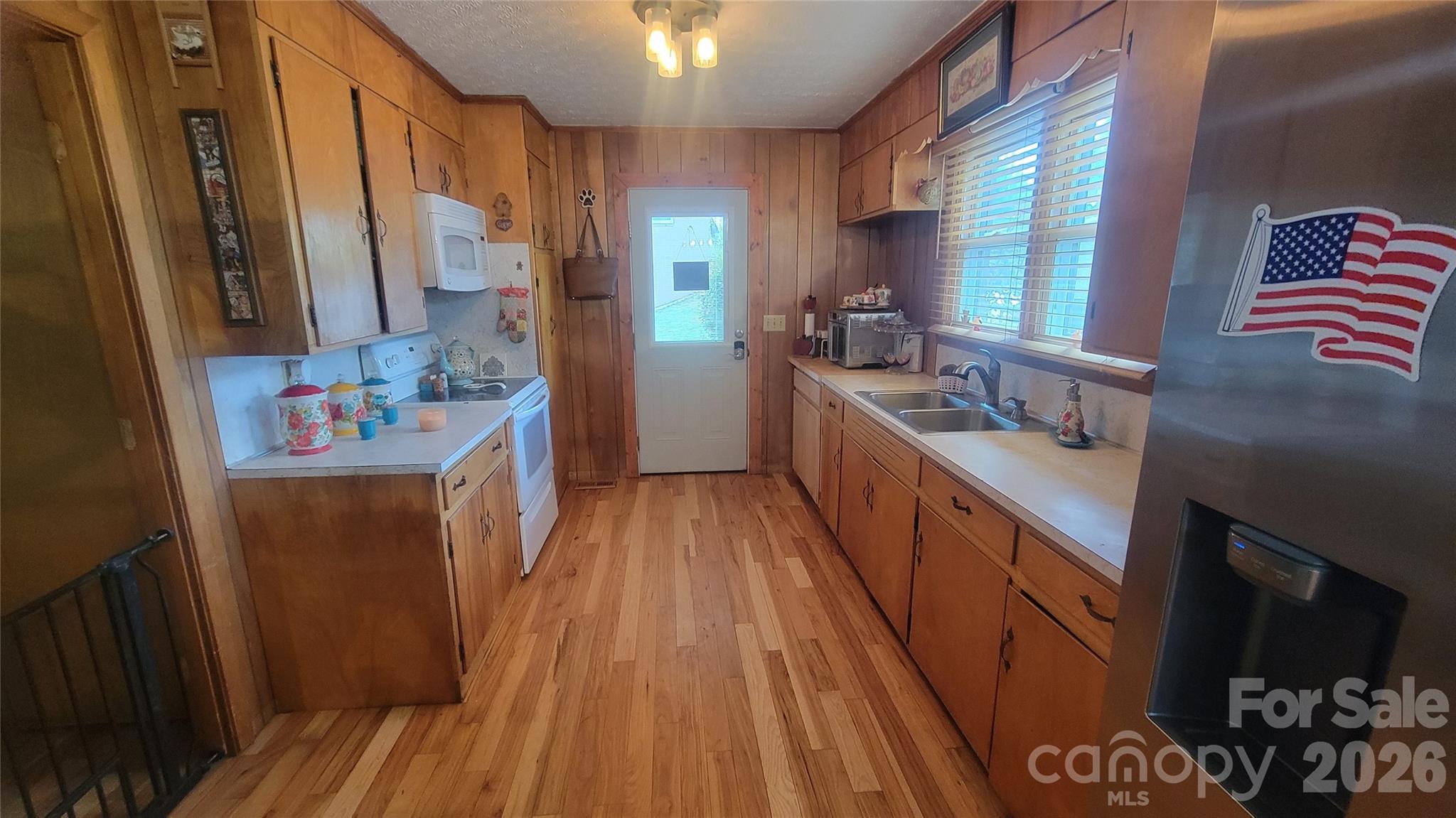 1082 Maple Street Granite Falls, NC 28630 - Photo 8 of 25 a kitchen with stainless steel appliances a sink stove and cabinets