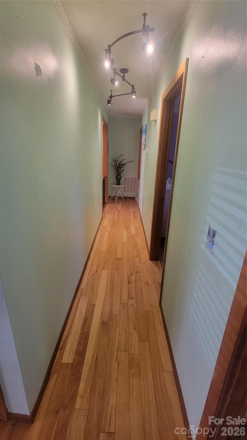 1082 Maple Street Granite Falls, NC 28630 - Photo 9 of 25 a view of a hallway with wooden floor