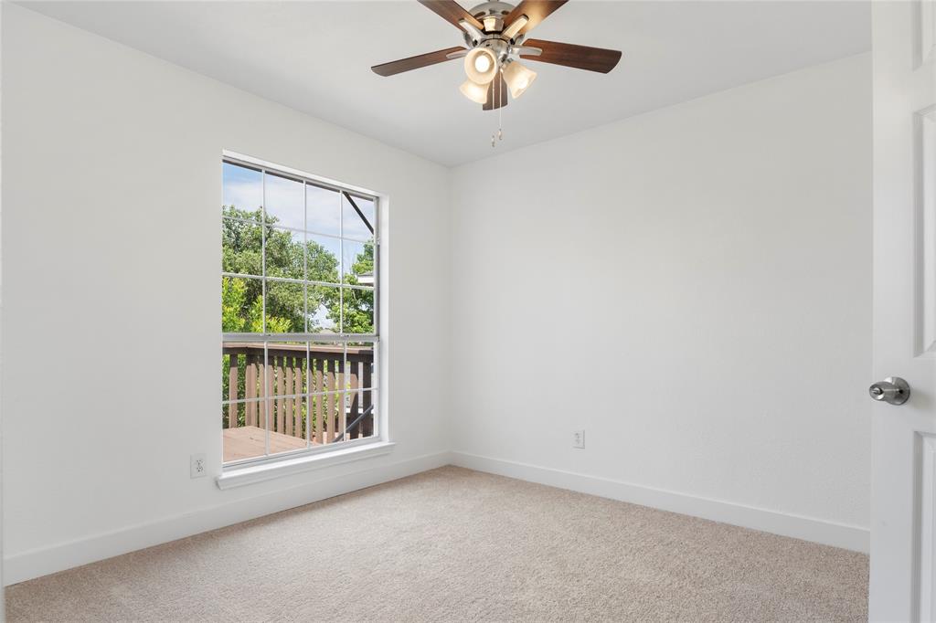 559 Raintree Circle Coppell, TX 75019 - Photo 29 of 40 Bright room with neutral carpet flooring and white walls