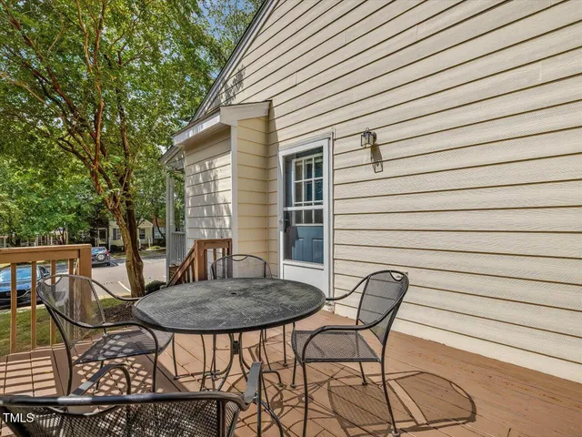 a view of a house with backyard and deck
