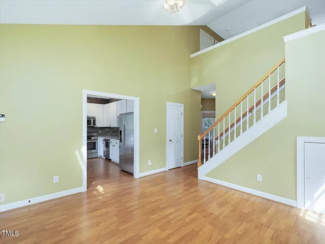 a kitchen with stainless steel appliances granite countertop a refrigerator sink and stove