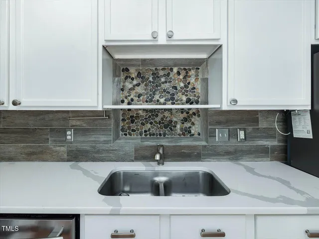 a kitchen with a stove and a microwave