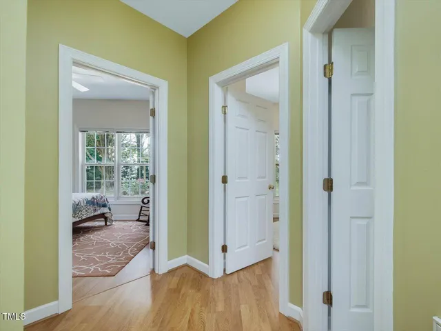 a bedroom with a bed chair and window