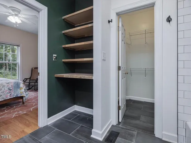 a view of an empty room with a window